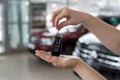 Dealer woman is holding in her hands the keys to the new car. Modern and prestigious vehicles Royalty Free Stock Photo