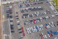 Dealership parking lot, many cars top aerial view