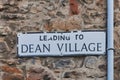 Dean Village Sign on a stone wall in Edinburgh