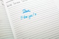 Dear, I love you, handwriting text on page of office agenda. Copy space