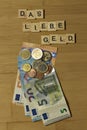 The dear money, word in german Das liebe Geld