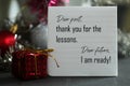 Dear past, thank you for the lessons. Dear future, i am ready. A self letter on a notepaper and red Christmas gift box. Royalty Free Stock Photo