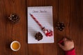 Dear Santa letter, child writes a Christmas card. Childhood dreams about gifts. New year concept Royalty Free Stock Photo