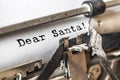Dear Santa typed words on a vintage typewriter. Close up