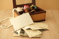 Dear to heart memorabilia in an old wooden box, lock of hair, stack of retro photos, vintage photographs of 40s - 50s, concept