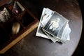 Dear to heart memorabilia in an old wooden box, a stack of retro photos, vintage photographs of 1960, concept of family tree,