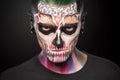 Death face painting on mans face. Royalty Free Stock Photo