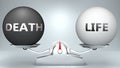 Death and life in balance - pictured as a scale and words Death, life - to symbolize desired harmony between Death and life in Royalty Free Stock Photo