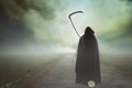 Death with scythe in a surreal landscape Royalty Free Stock Photo