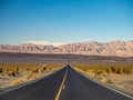 Death Valley, Mojave Desert lone empty road, California, USA: The hottest place on the planet Earth, black and white art photo Royalty Free Stock Photo