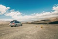 Death Valley National Park road trip. Desert landscape and one car on an unpaved road Royalty Free Stock Photo