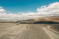 Death Valley National Park road trip. Desert landscape and one car on an unpaved road Royalty Free Stock Photo