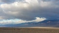 Death Valley salt flats with menacing clouds Royalty Free Stock Photo