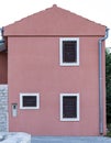 Deatil of a facade of a pink building Royalty Free Stock Photo