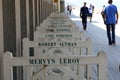 Pedestrians walk along the Promenade des Planches, where names of film stars who have