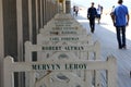 Pedestrians walk along the Promenade des Planches, where names of film stars who have Royalty Free Stock Photo