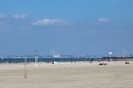 A view across the sands of Deauville beach and the English Channel towards the Royalty Free Stock Photo