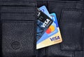 Debit and Credit cards in black color wallet. Top view