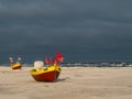 Debki beach, colorful fishing boats at the seashore. Poland