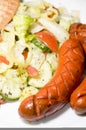 Debrecziner Hungarian sausage with salad Royalty Free Stock Photo