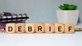 debrief word in a dictionary. debrief concept Royalty Free Stock Photo
