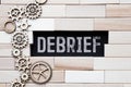 debrief word in a dictionary. debrief concept Royalty Free Stock Photo