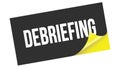 DEBRIEFING text on black yellow sticker stamp Royalty Free Stock Photo