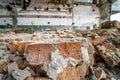 Debris of bricks in ruins of the destroyed factory building inside Royalty Free Stock Photo