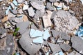 Debris, broken concrete panels, tiles on a sunny day, view from above