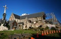 Debris of partially collapsed historic Christchurch Cathedral supported by steel frame seismic bracing in New Zealand