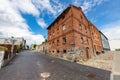 Debrzno, pomorskie / Poland Ã¢â¬â July, 23, 2020: Old tenement house built of red brick. A run down building in a small town Royalty Free Stock Photo