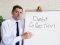 Debt collection concept. The banker shows white board with the inscription.