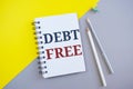 Debt Free text with notepad. Conceptual photo Credit Money Financial Sign Freedom From Loan Mortage .Business photo showcasing Royalty Free Stock Photo