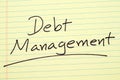 Debt Management On A Yellow Legal Pad