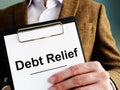 Debt relief application with clipboard. Royalty Free Stock Photo