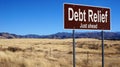 Debt Relief brown road sign Royalty Free Stock Photo