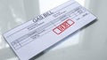 Debt seal stamped on gas bill, payment for services, month expenses, tariff