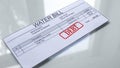 Debt seal stamped on water bill, payment for services, month expenses, tariff
