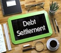 Debt Settlement Concept on Small Chalkboard. 3D. Royalty Free Stock Photo