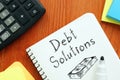 Debt solutions are shown using the text and picture of dollars Royalty Free Stock Photo
