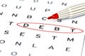Debt in solving crossword puzzle Royalty Free Stock Photo