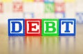 Debt Spelled Out in Alphabet Building Blocks Royalty Free Stock Photo