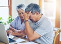Debt, stress and senior couple with finance bills, paperwork and insurance documents on laptop. Retirement, anxiety and Royalty Free Stock Photo