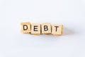 DEBT word concept. Wooden blocks with the word debt. Concept of financial crisis and problems. Risk management.