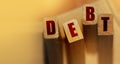 DEBT word made with wooden blocks. Liability unprofitable business or personal loss concept Royalty Free Stock Photo