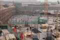 18 Dec,2014 Beijing. Work activity on a construction site in City with cranes and workers Royalty Free Stock Photo