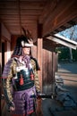 Man in Samurai armor holding Japanese Katana sword