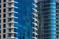 Four industrial alpinists cleaning large skyscraper windows at Dubai Marina