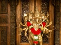 The Statue of Golden 5 Heads Ganesha Carving behind Sculptured Wood Royalty Free Stock Photo