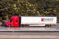 Dec 8, 2019 Los Angeles / CA / USA - Knight Transportation truck driving on the freeway; Knight-Swift Transportation Holdings Inc